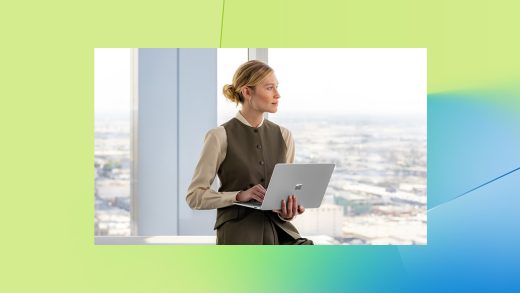 A woman holding a laptop