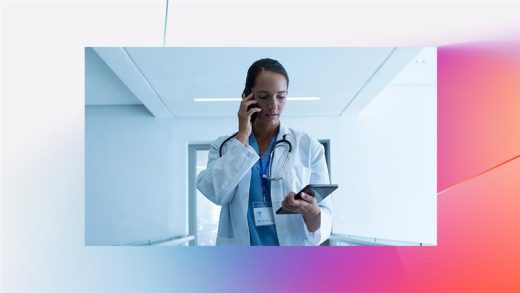 A woman in a white coat holding a tablet and talking on the phone