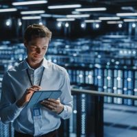 data-center-man-it-specialist-tablet