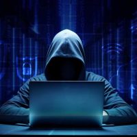 hooded hacker online security concept