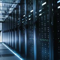 Photo of Out of Focus IT Technician Turning on Data Server.