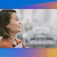 A woman looking off to the side with a smile