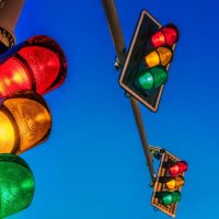 shutterstock 1801533685 multiple overhead traffic lights against an evening sky