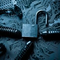 computer security breach due to worm attack - worm on computer circuit board with open security lock