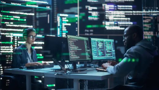 Portrait of Two Diverse Developers Working on Computers, Typing Lines of Code that Appear on Big Screens Surrounding Them. Male and Female Programmers Creating Innovative Software, Fixing Bugs.