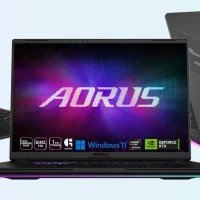 An ASUS ROG Flow Z13 tablet, a GIGABYTE AORUS MASTER 16 laptop and an ASUS ROG Strix SCAR 18 laptop side by side on a light background