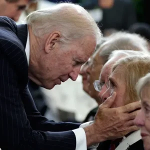 Joe biden comforting elderly woman
