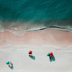 Aerial beach umbrellas sand