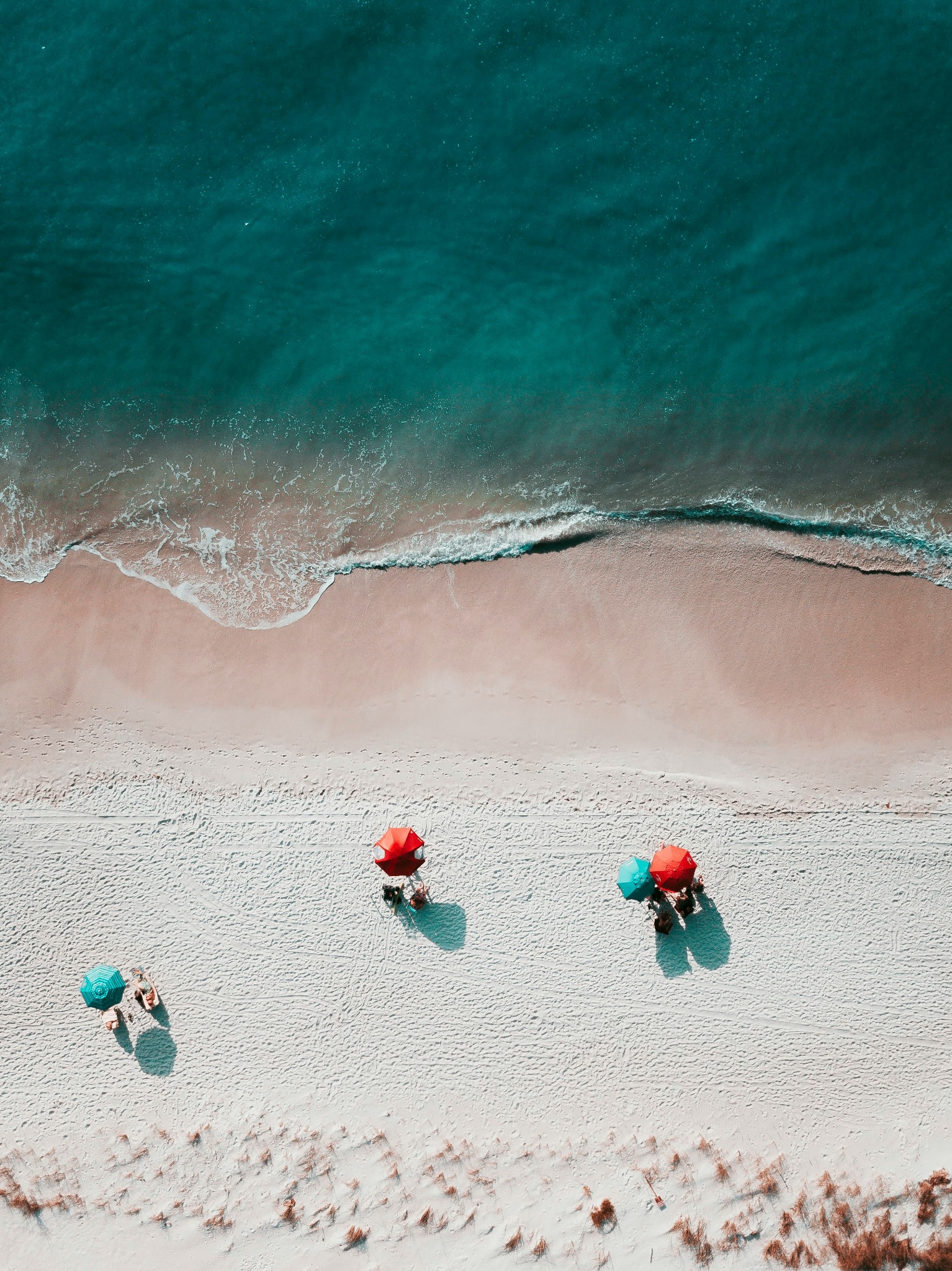 Aerial beach umbrellas sand