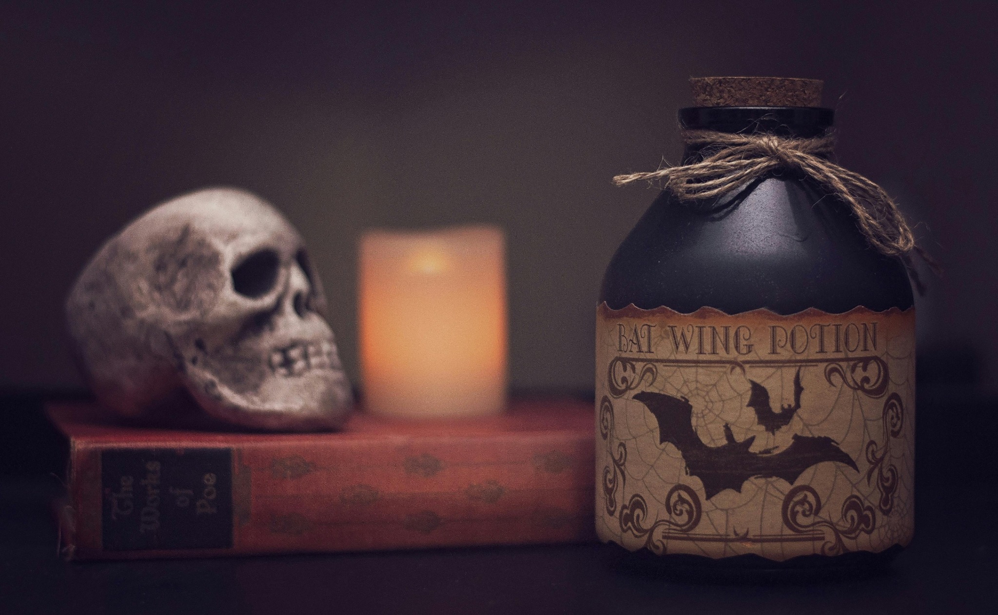 Bat wing potion skull candle