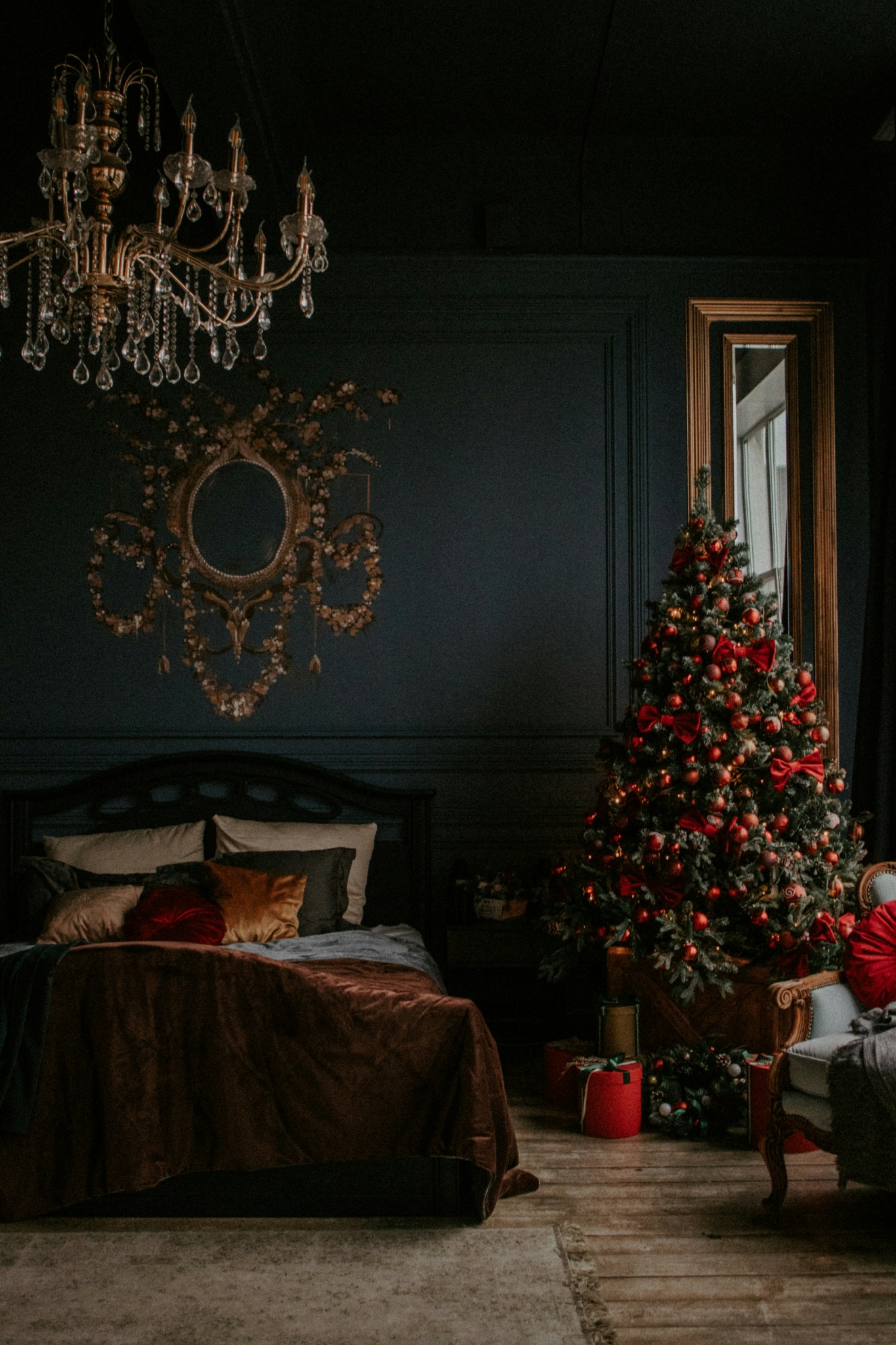 Cat napping by decorated christmas tree