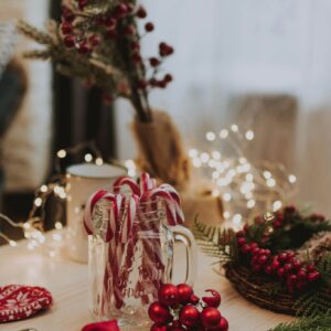 Christmas candy canes in glass mug