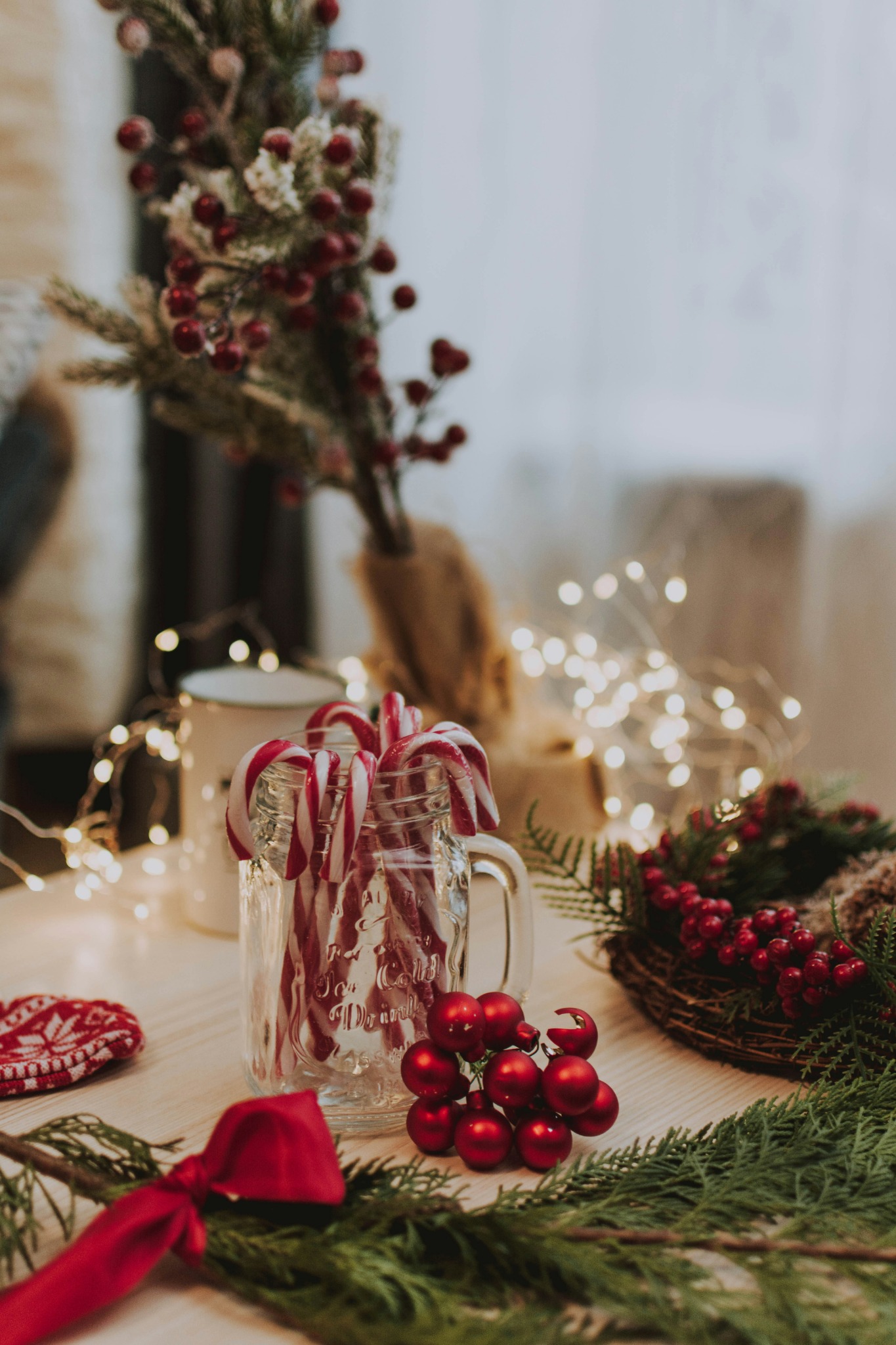 Christmas candy canes in glass mug