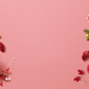 Christmas ornaments pink background flatlay