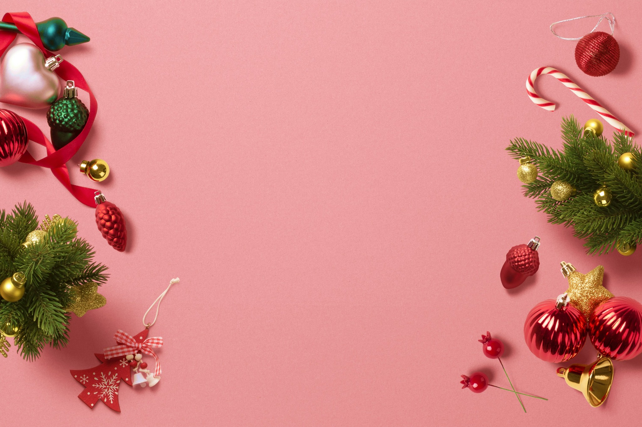 Christmas ornaments pink background flatlay