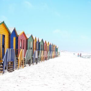 Colorful beach huts sandy shore