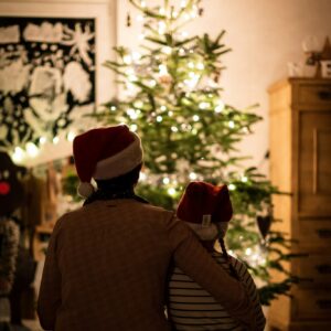 Family enjoying christmas tree