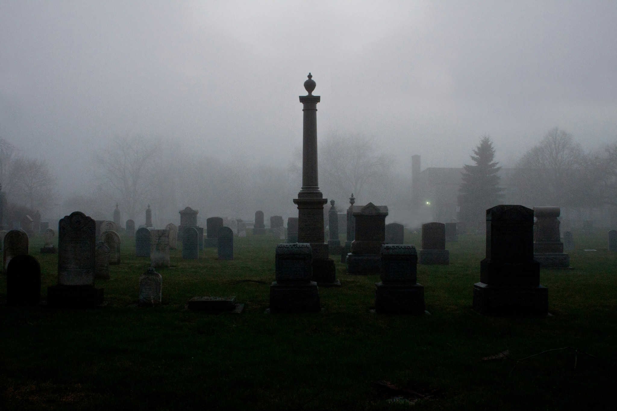 Foggy cemetery tombstones haze