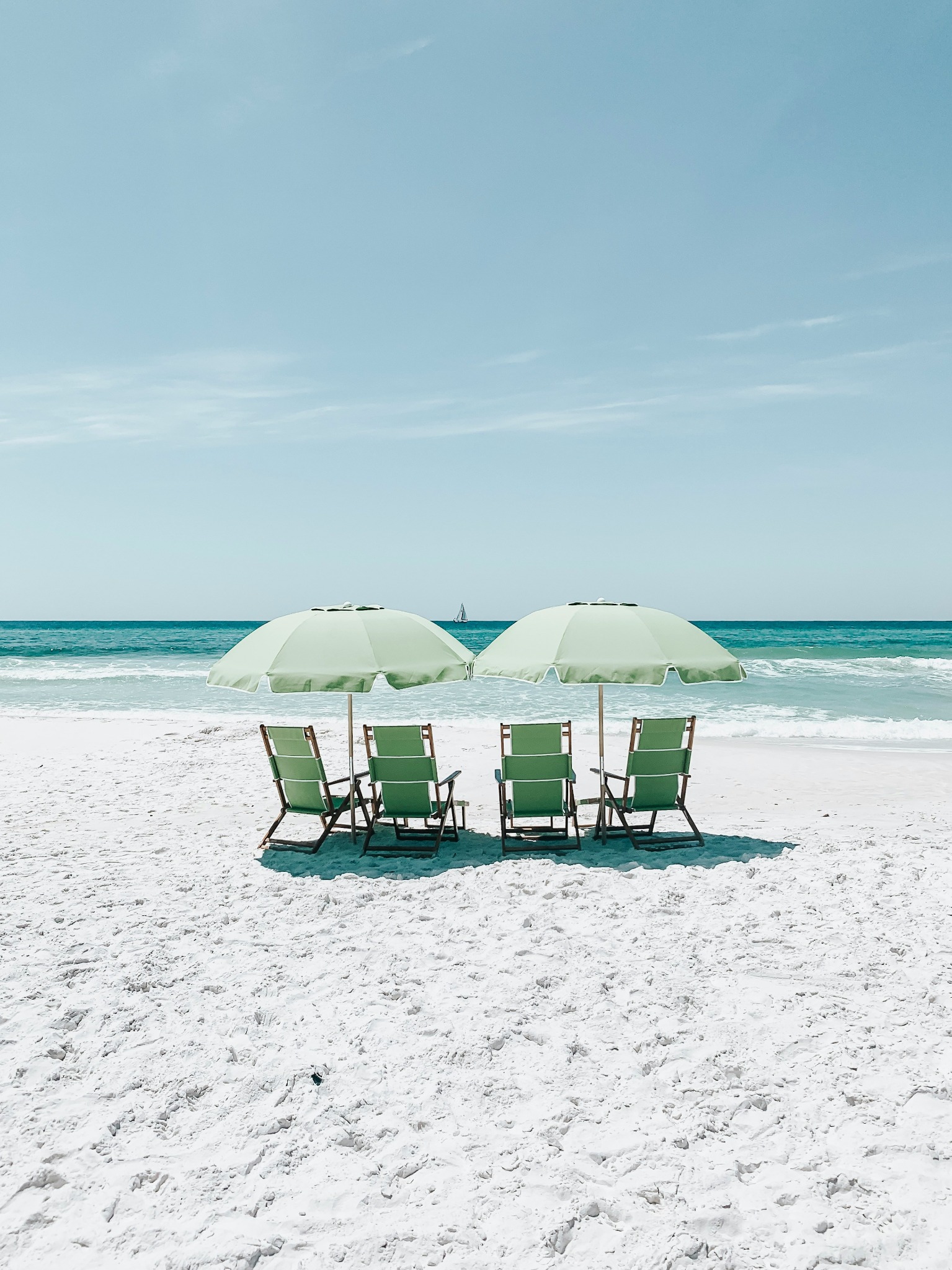 Green beach umbrellas chairs