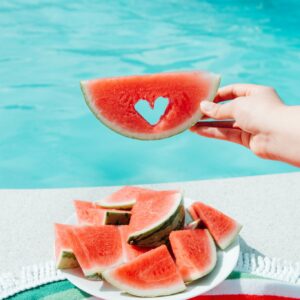 Heart shaped watermelon slice poolside