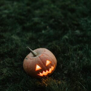 Jack o lantern on grass night