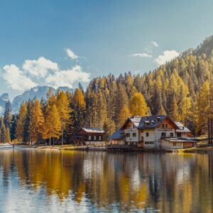 Lakeside house autumn forest mountains