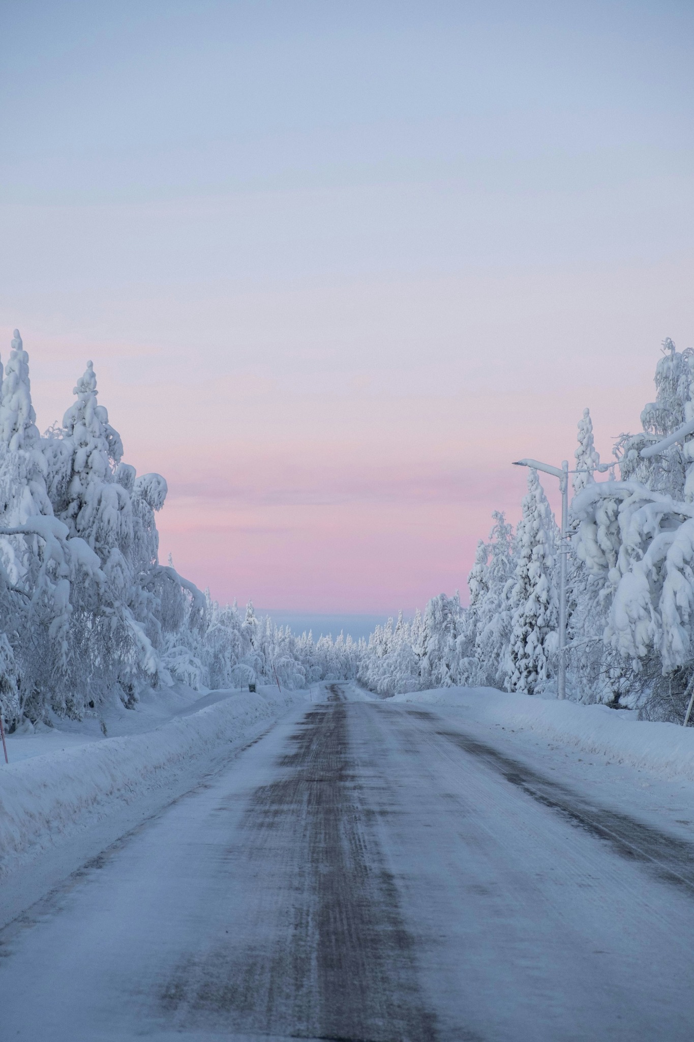 Snowy road pink sky