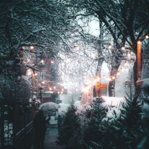 Snowy street festive lights umbrella