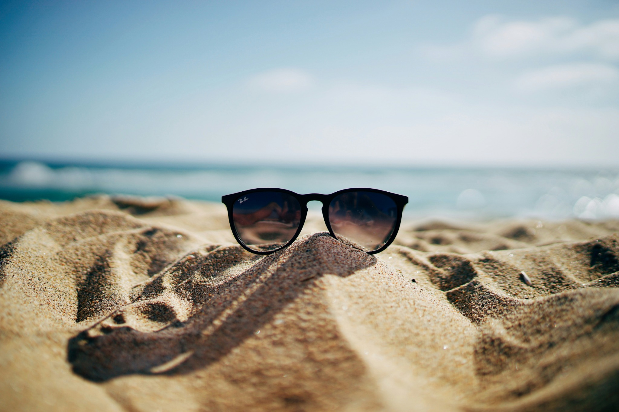 Sunglasses in sand beach
