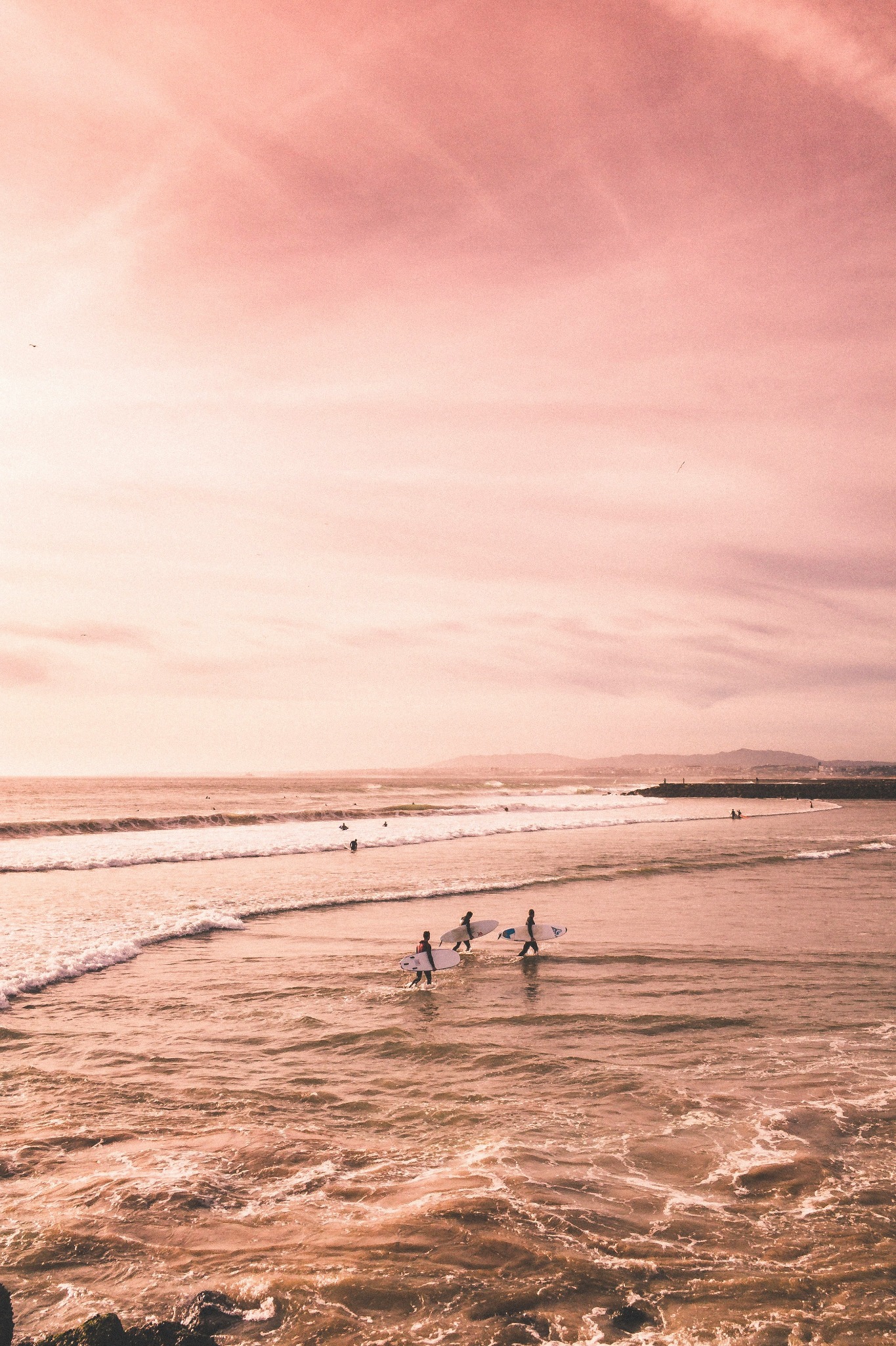 Surfers beach sunset pink sky