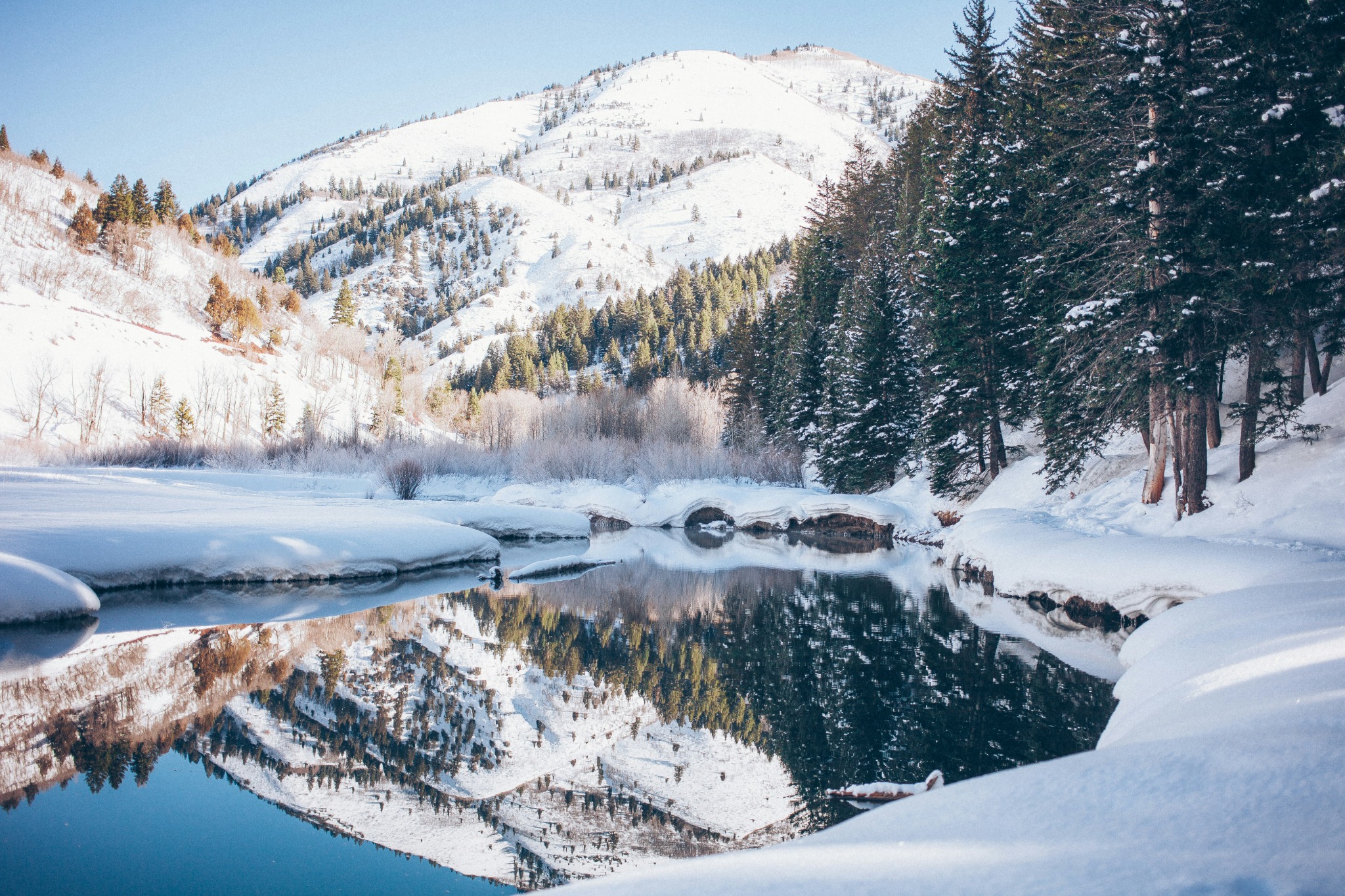 Tranquil winter river snow reflection