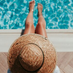 Woman relaxing poolside summer