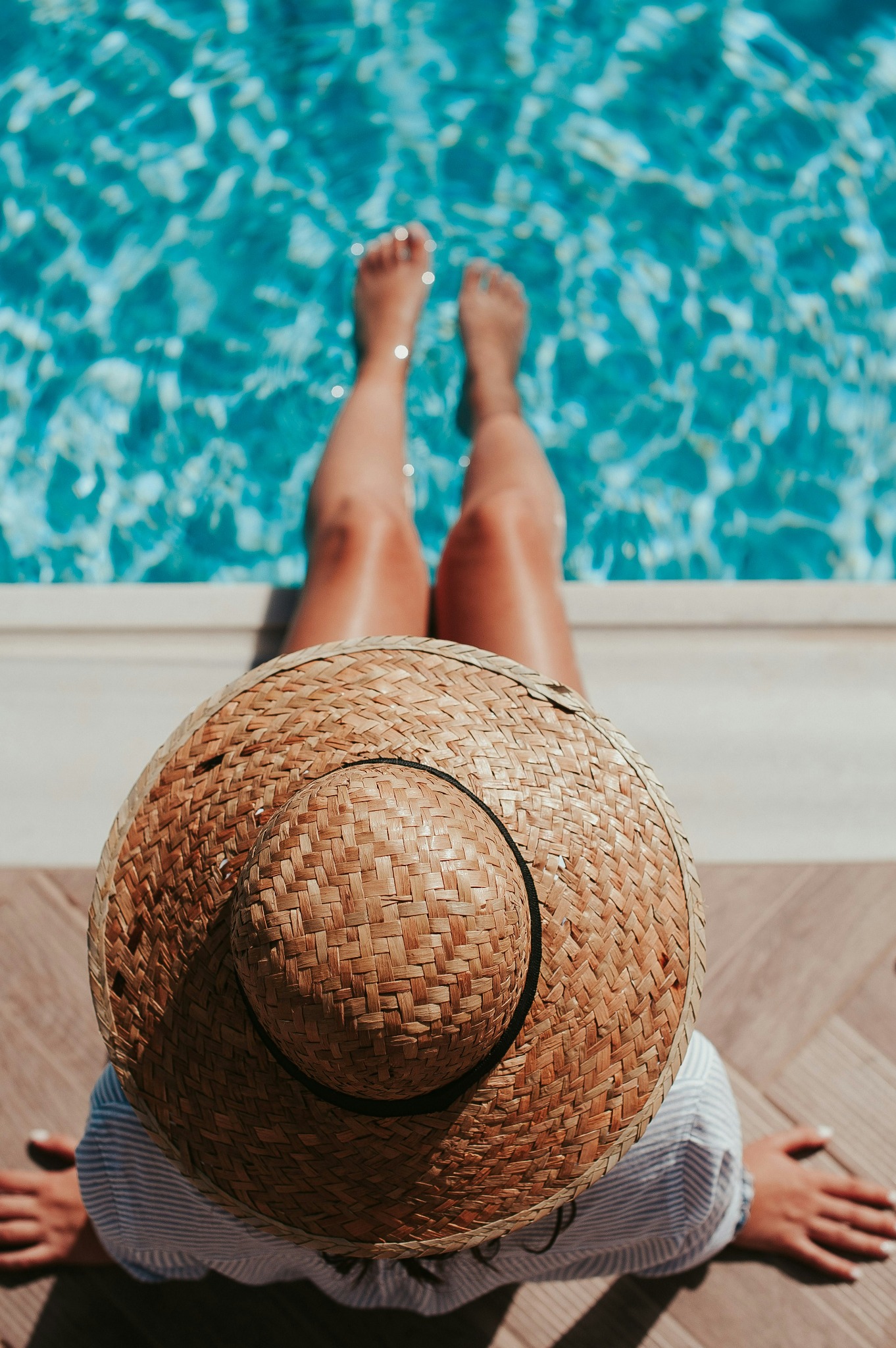 Woman relaxing poolside summer