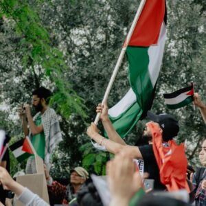 Palestinian flag in protest scene wallpaper