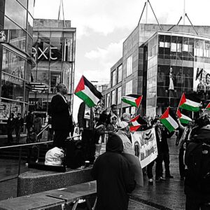 Palestinian flag protest in urban setting wallpaper