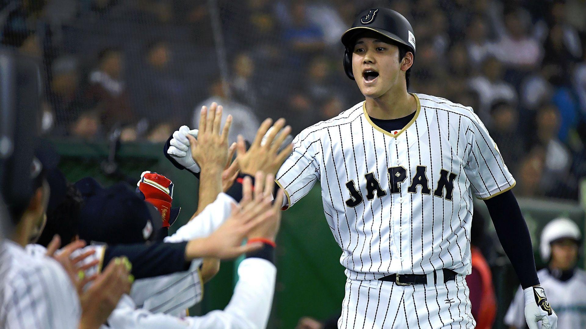 Shohei ohtani high fives japan jersey