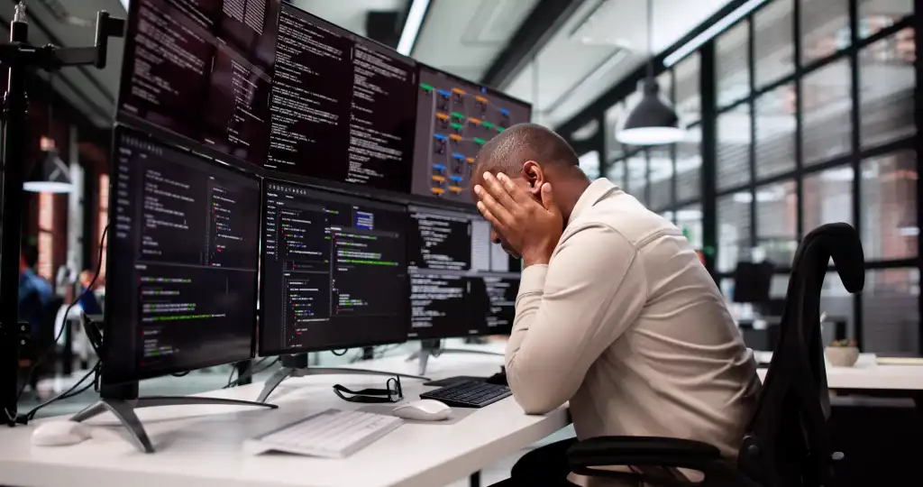 Unhappy Programmer Caught In Maze Of Broken Software And Stress.