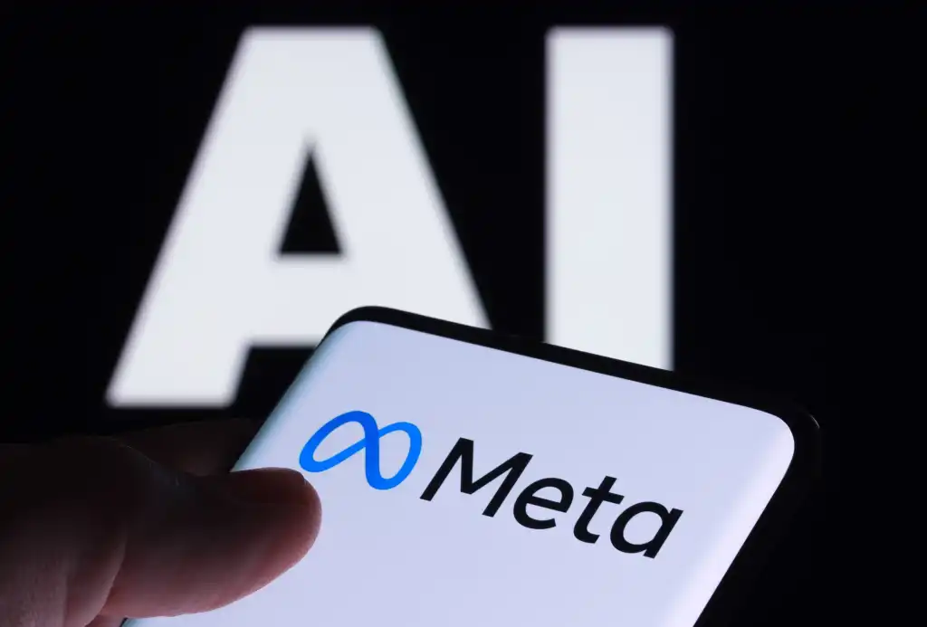 Meta logo seen on smartphone and AI letters on the background. Concept for Meta Facebook Artificial Intelligence. Stafford, UK, May 2, 2023