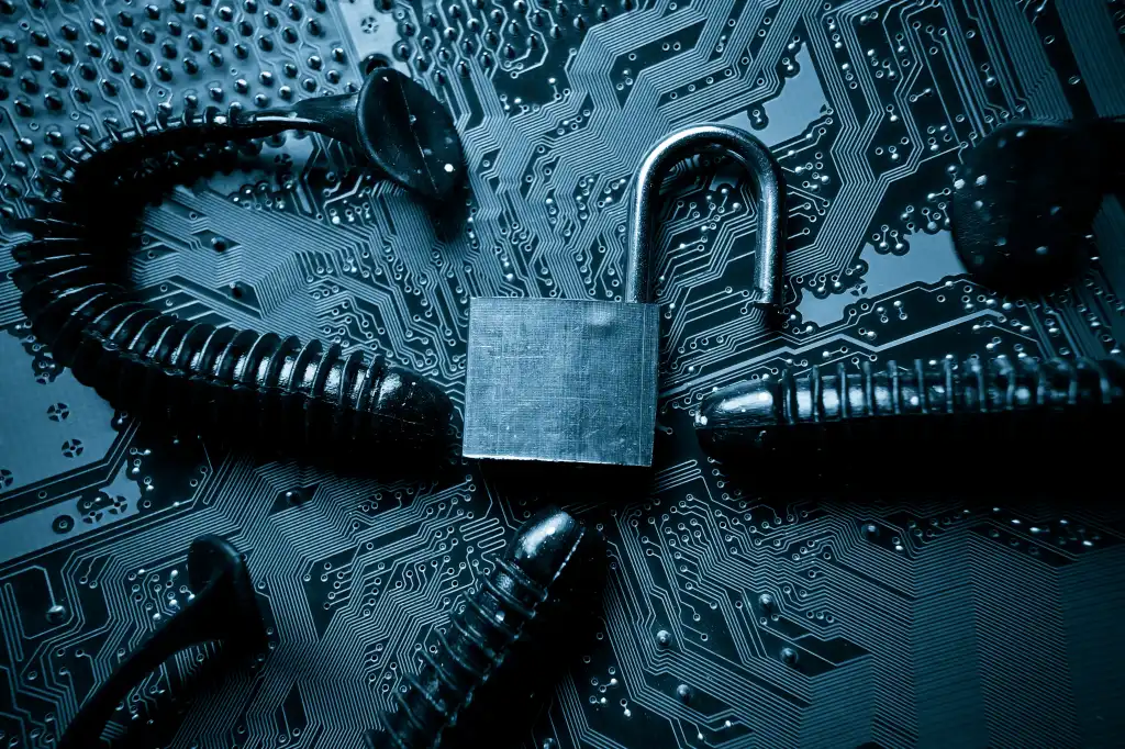 computer security breach due to worm attack - worm on computer circuit board with open security lock