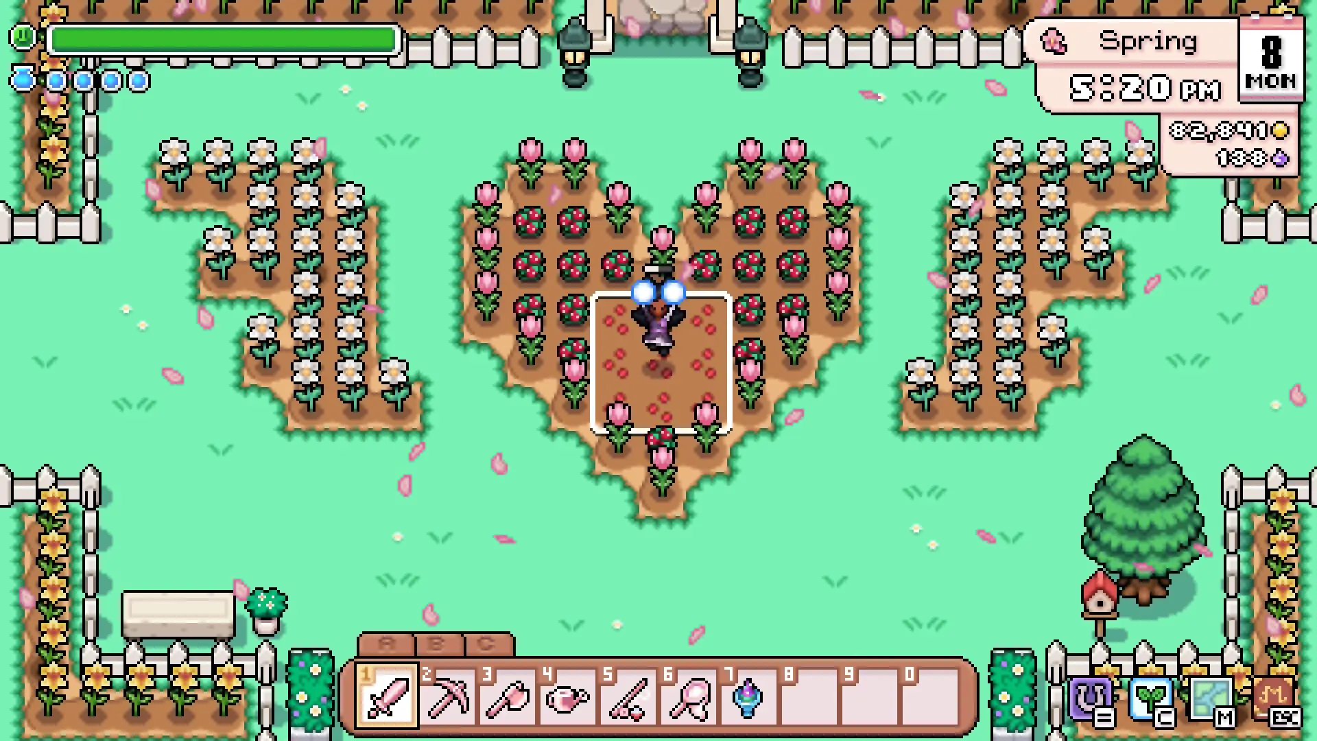 A spring farm in Fields of Mistria where the crops are laid out as a giant heart of pink tulips flanked by beds of white flowers