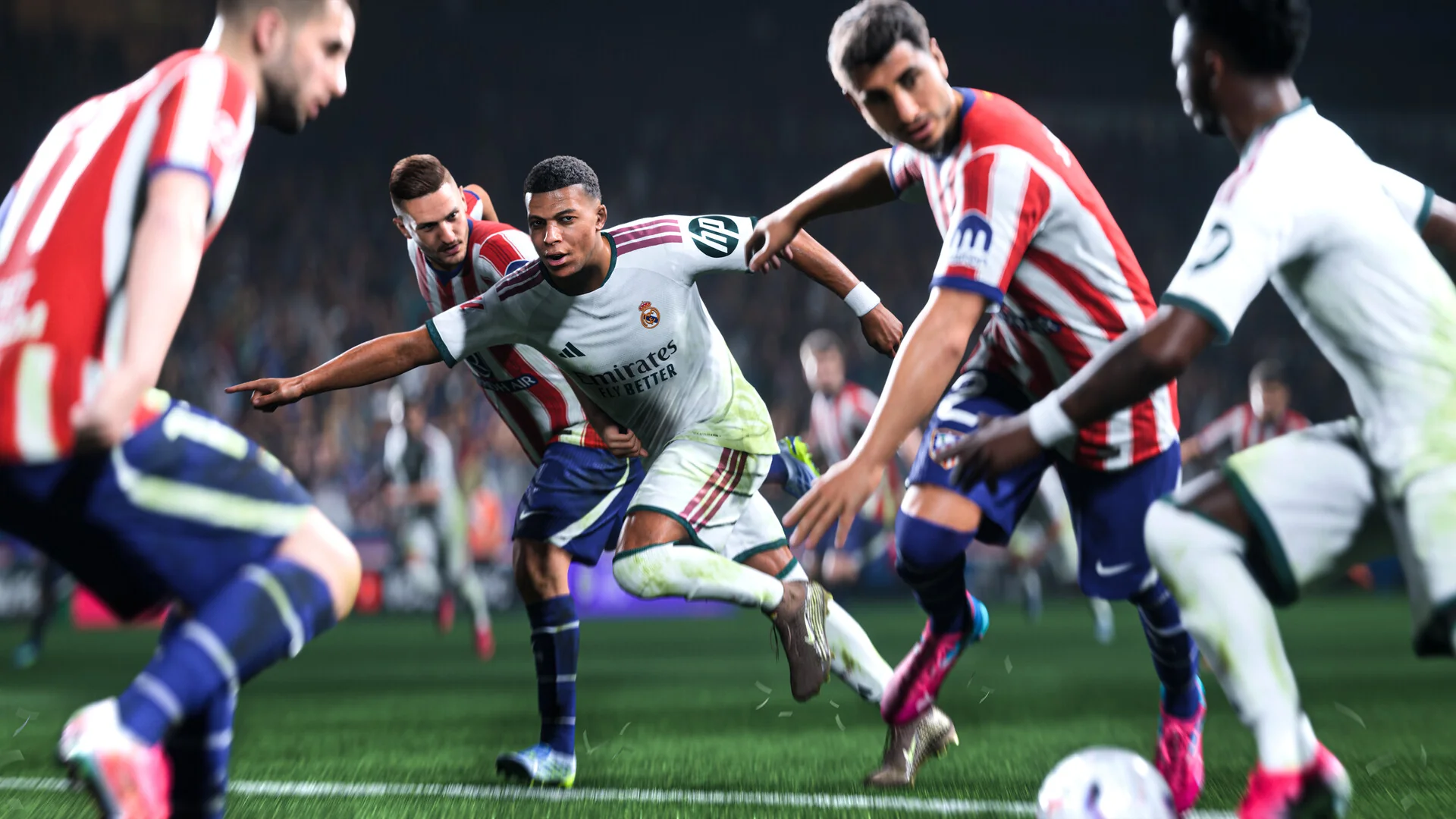 A forward in a white kit dribbles past defenders in red and white stripes