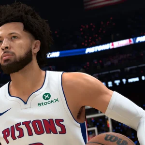 Close up of Cade Cunningham in a white Detroit Pistons jersey holding a basketball in NBA 2K27