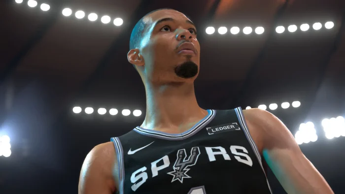 NBA 2K27 Victor Wembanyama player model Victor Wembanyama in a black San Antonio Spurs jersey looking up under arena lights in NBA 2K27