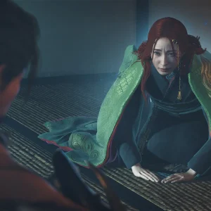 A red haired woman in a green and black kimono kneels on tatami matting facing Musashi