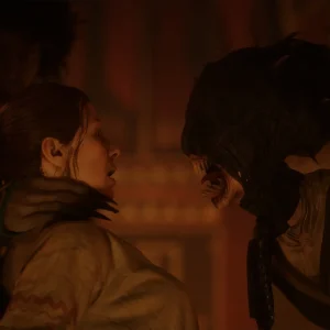 A close up tense confrontation between two characters by firelight in The Blood of Dawnwalker