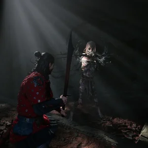 Coen with sword drawn facing a ghostly figure in ruins in The Blood of Dawnwalker