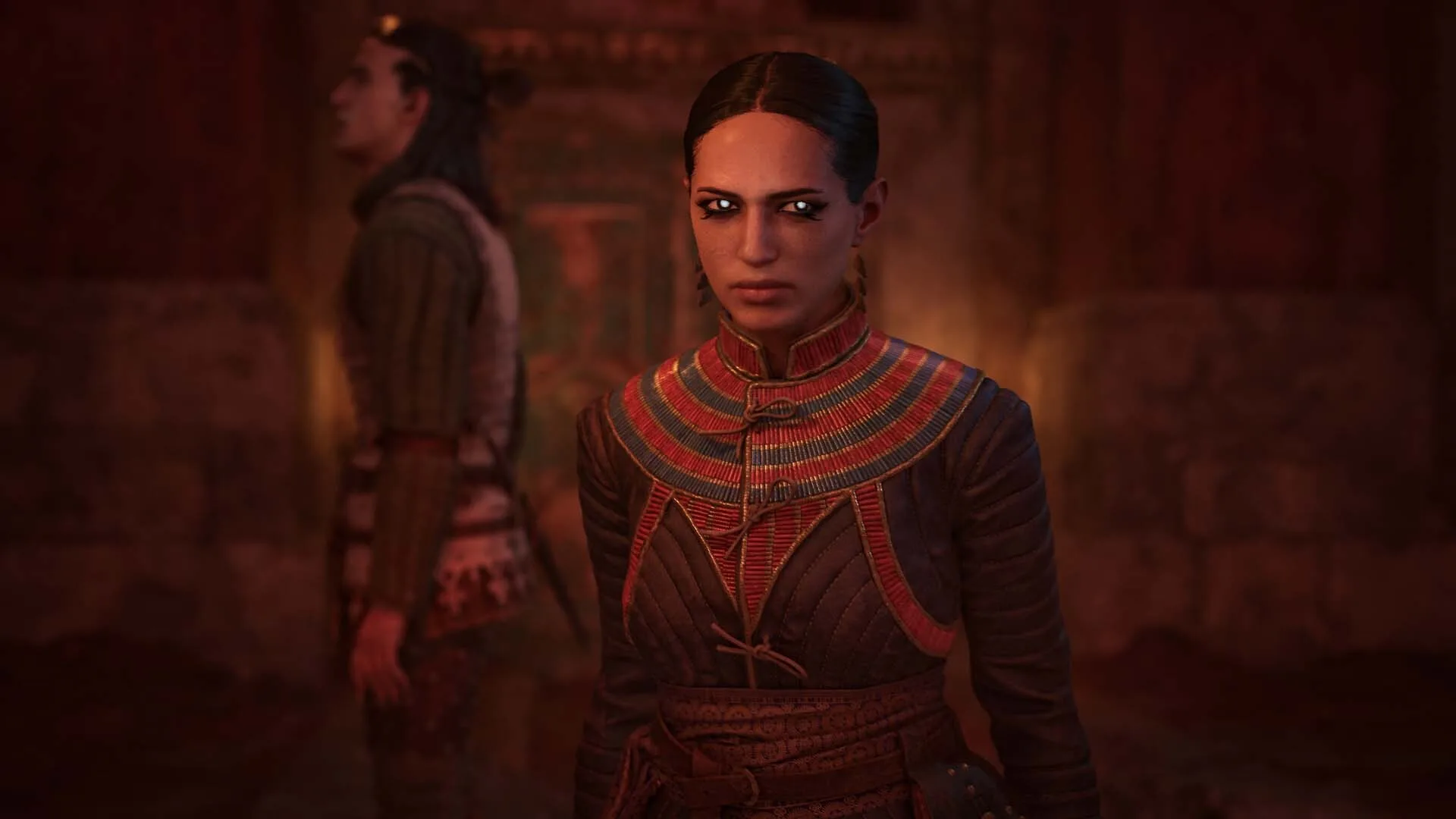 A woman in a red embroidered medieval coat in The Blood of Dawnwalker