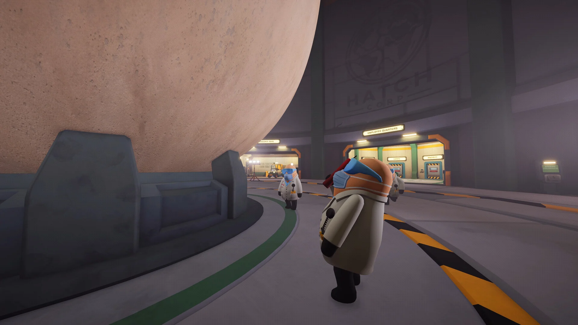 A lab worker in a white coat walks along the curved floor around the base of the giant egg, with coworkers in the distance