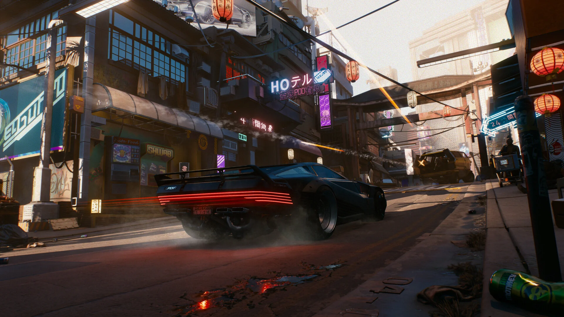 A black muscle car speeds down a Japantown street lined with paper lanterns and shop signs