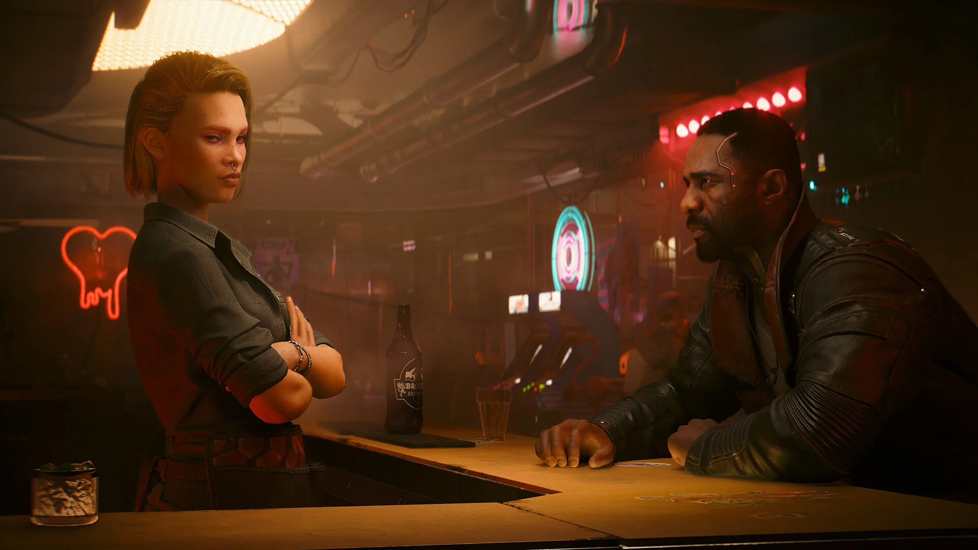 Solomon Reed leans on a bar counter talking to a woman with her arms crossed, under red neon signs